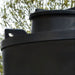 Side view of the black MDPE lifteye lifting point on a 13,000 litre, tall, above-ground rainwater harvesting tank by Ecosure.