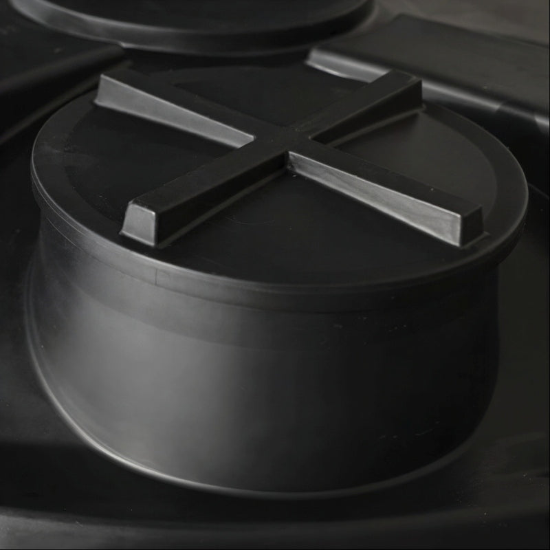 Top view of the black MDPE tank lid on a 25,000 litre, large, above-ground rainwater harvesting tank by Ecosure.